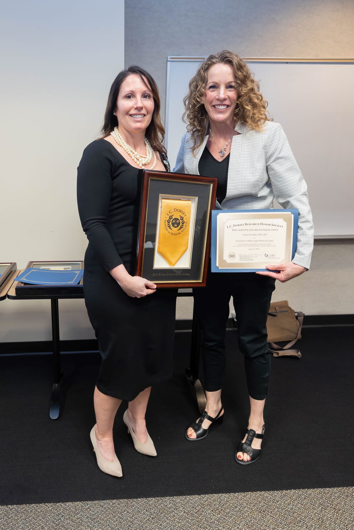 Dr. Gamble new inductee into the L.C. Dorsey Honors Society standing with Dr. Reneker at the 2023 SOPH Research Day